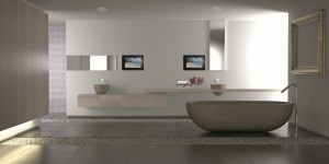 Minimalist white bathroom with stone bathtub and pebbles